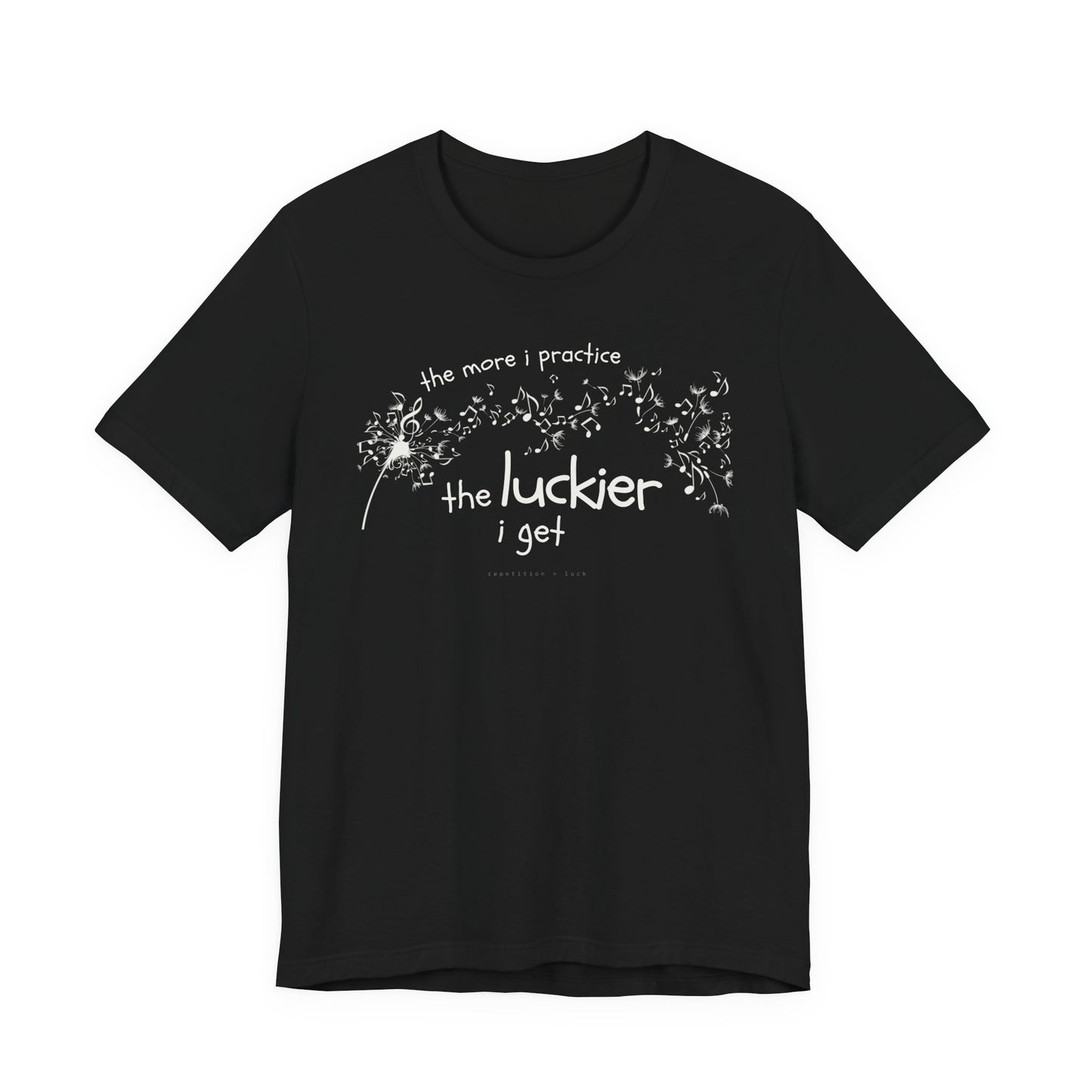 Front view of a black Bella Canvas t-shirt with a clever music-themed graphic. The design shows a stylized guitar headstock and musical notes above text that reads: ‘The more I practice, the luckier I get.’ Soft 100% cotton shirt perfect for musicians and music teachers.