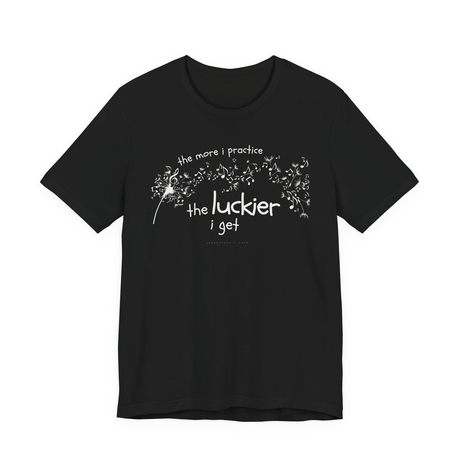 Front view of a black Bella Canvas t-shirt with a clever music-themed graphic. The design shows a stylized guitar headstock and musical notes above text that reads: ‘The more I practice, the luckier I get.’ Soft 100% cotton shirt perfect for musicians and music teachers.
