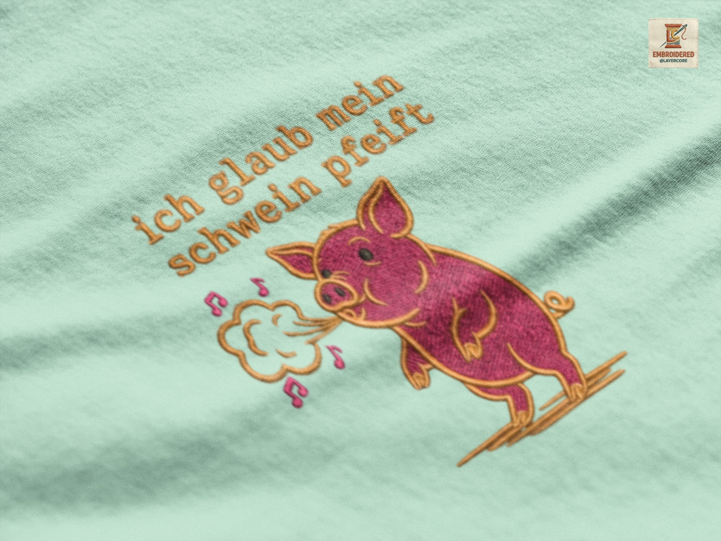 Besticktes T-Shirt "Ich glaub mein Schwein pfeift" auf Premium Baumwolle in heather mint