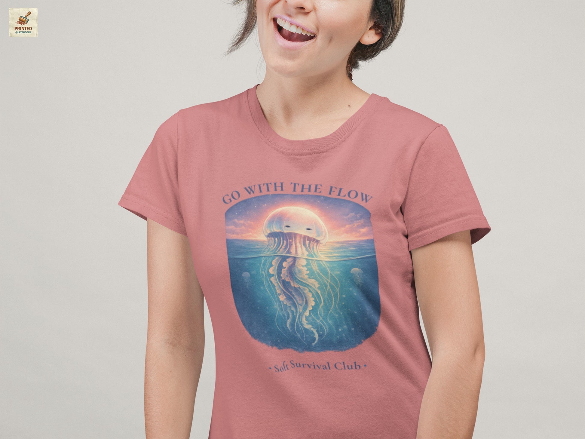 minimal jellyfish ocean aesthetic shirt with calm vintage design in mauve, worn by a young woman