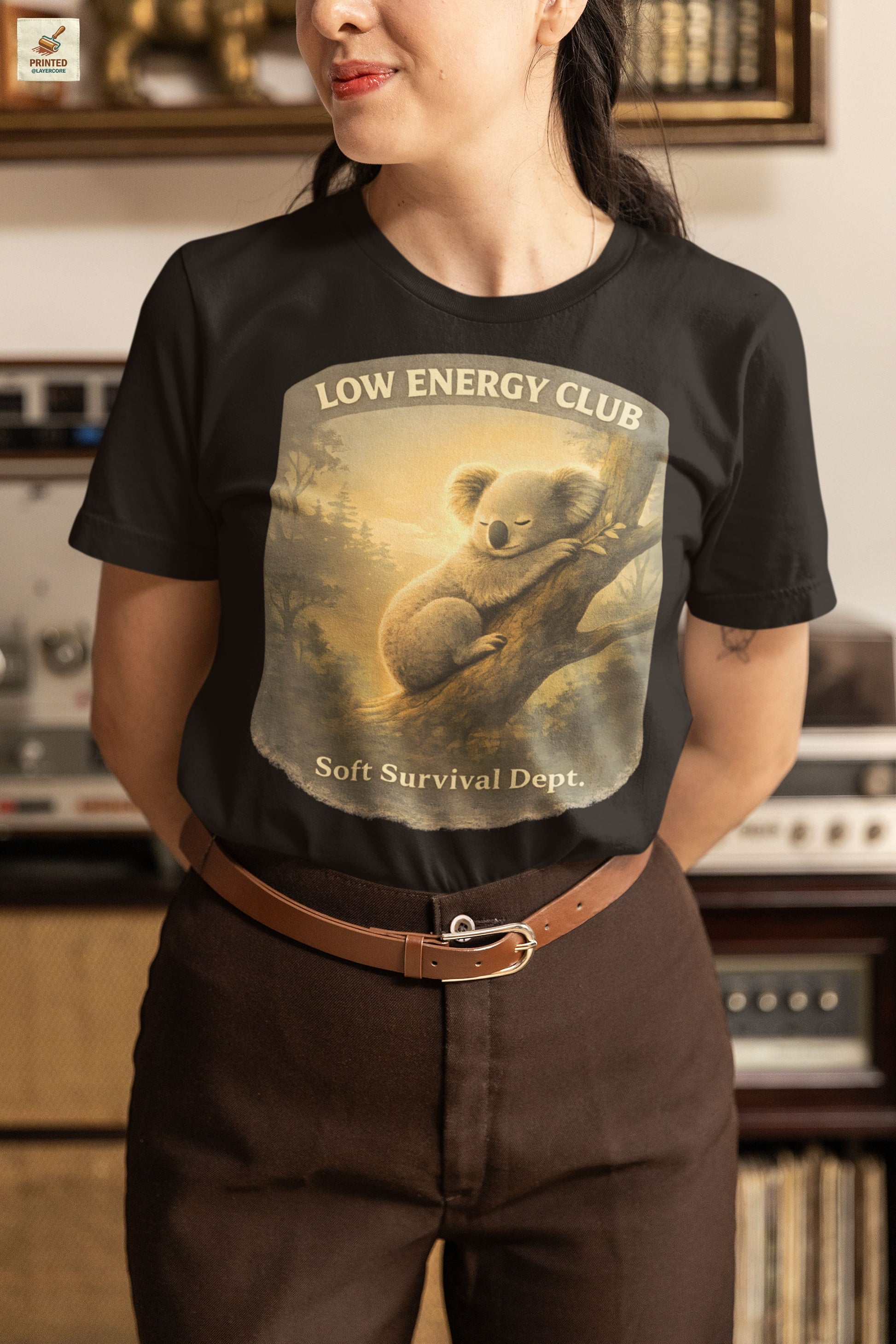 low energy club koala heather black shirt calm aesthetic vintage design, worn by a woman standing in an antique shop