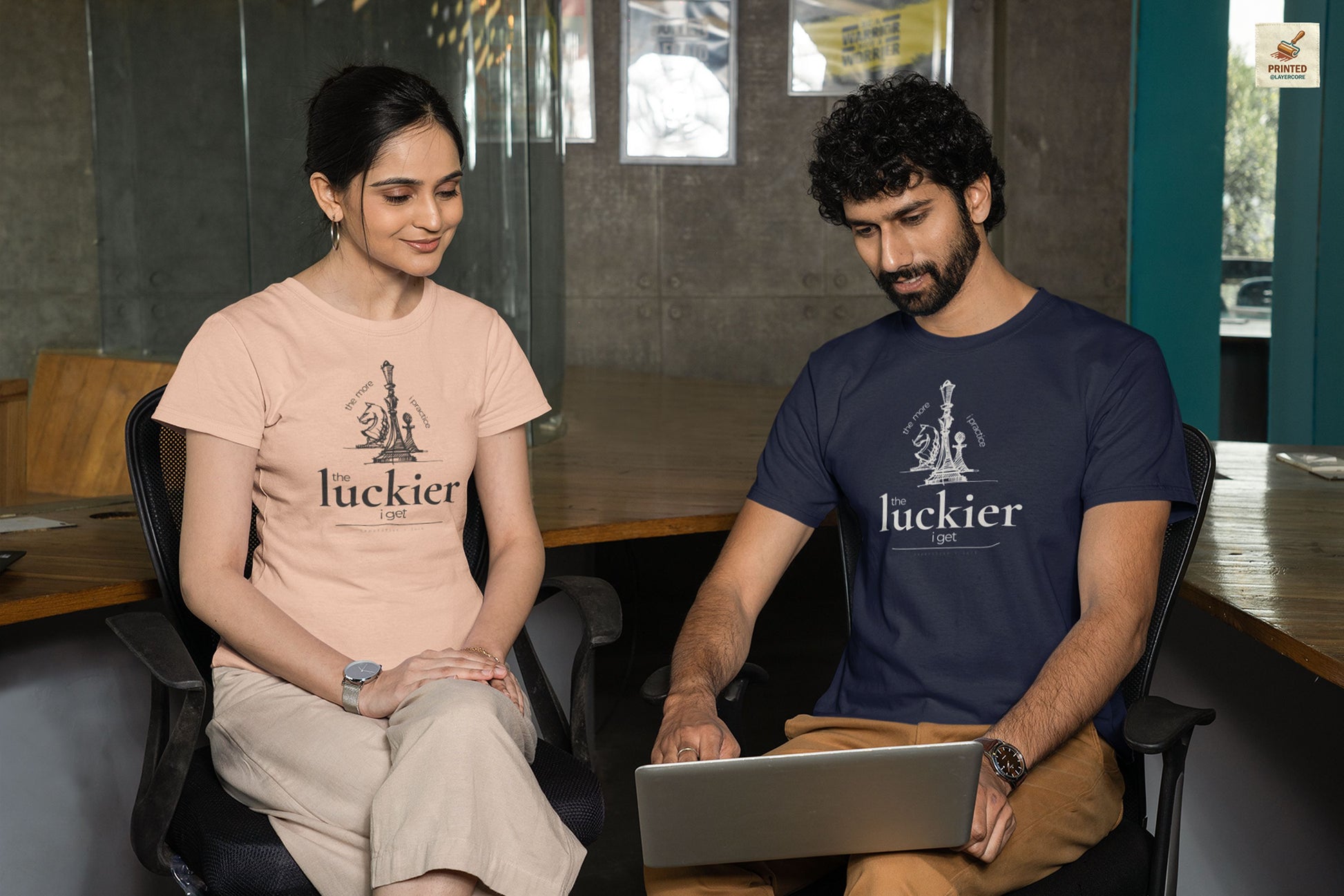 dark blue and peach coloured shirt mockup showing vintage chess sketch and the phrase the more I practice the luckier I get