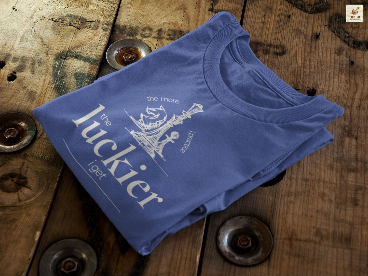 Navy blue shirt mockup showing vintage chess sketch and the phrase the more I practice the luckier I get