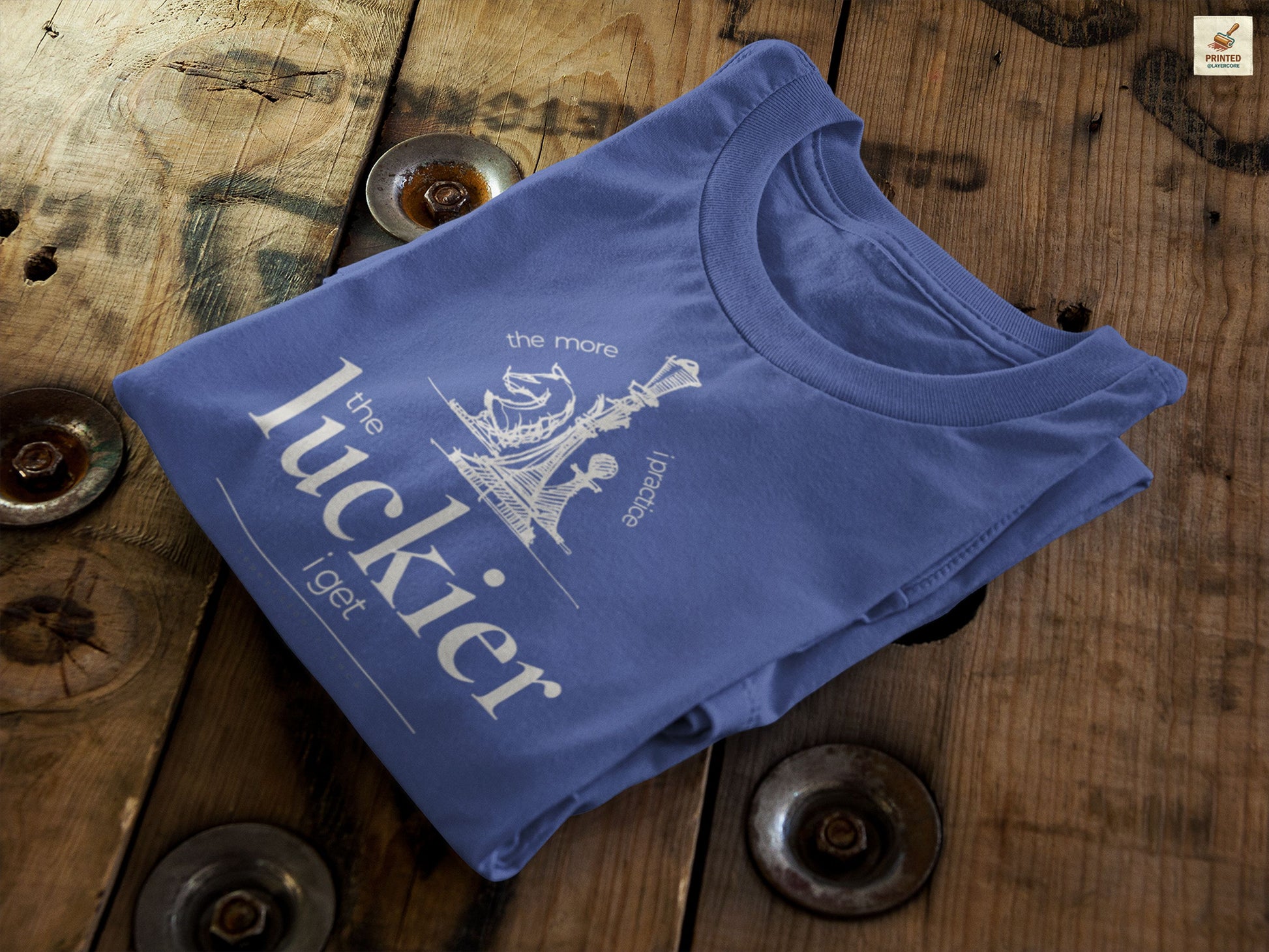 Navy blue shirt mockup showing vintage chess sketch and the phrase the more I practice the luckier I get