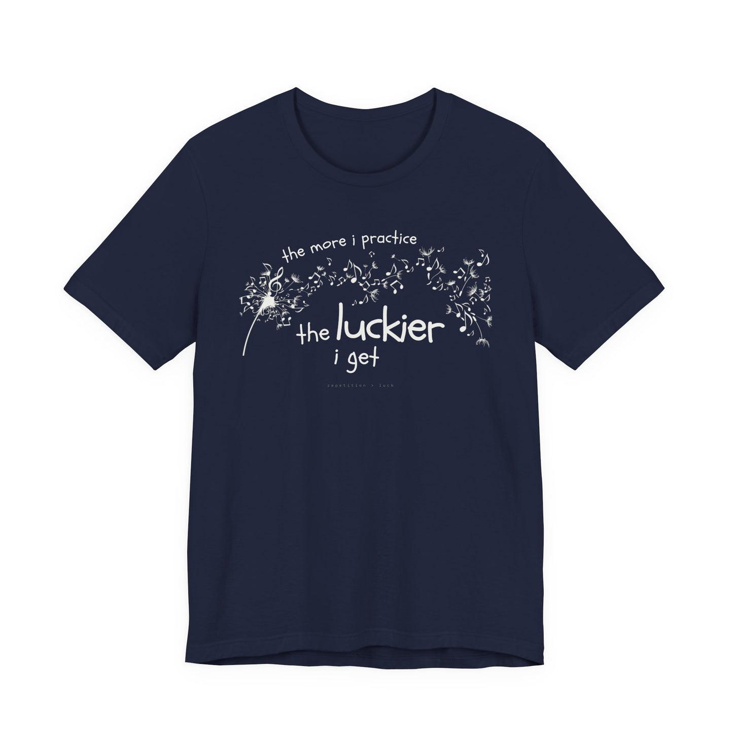 Front view of a blue Bella Canvas t-shirt with a clever music-themed graphic. The design shows a stylized guitar headstock and musical notes above text that reads: ‘The more I practice, the luckier I get.’ Soft 100% cotton shirt perfect for musicians and music teachers.