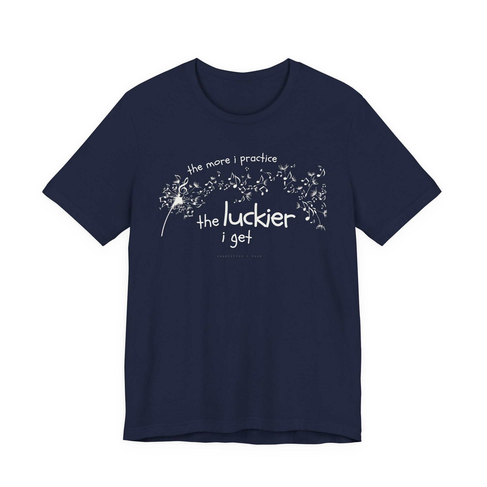 Front view of a blue Bella Canvas t-shirt with a clever music-themed graphic. The design shows a stylized guitar headstock and musical notes above text that reads: ‘The more I practice, the luckier I get.’ Soft 100% cotton shirt perfect for musicians and music teachers.