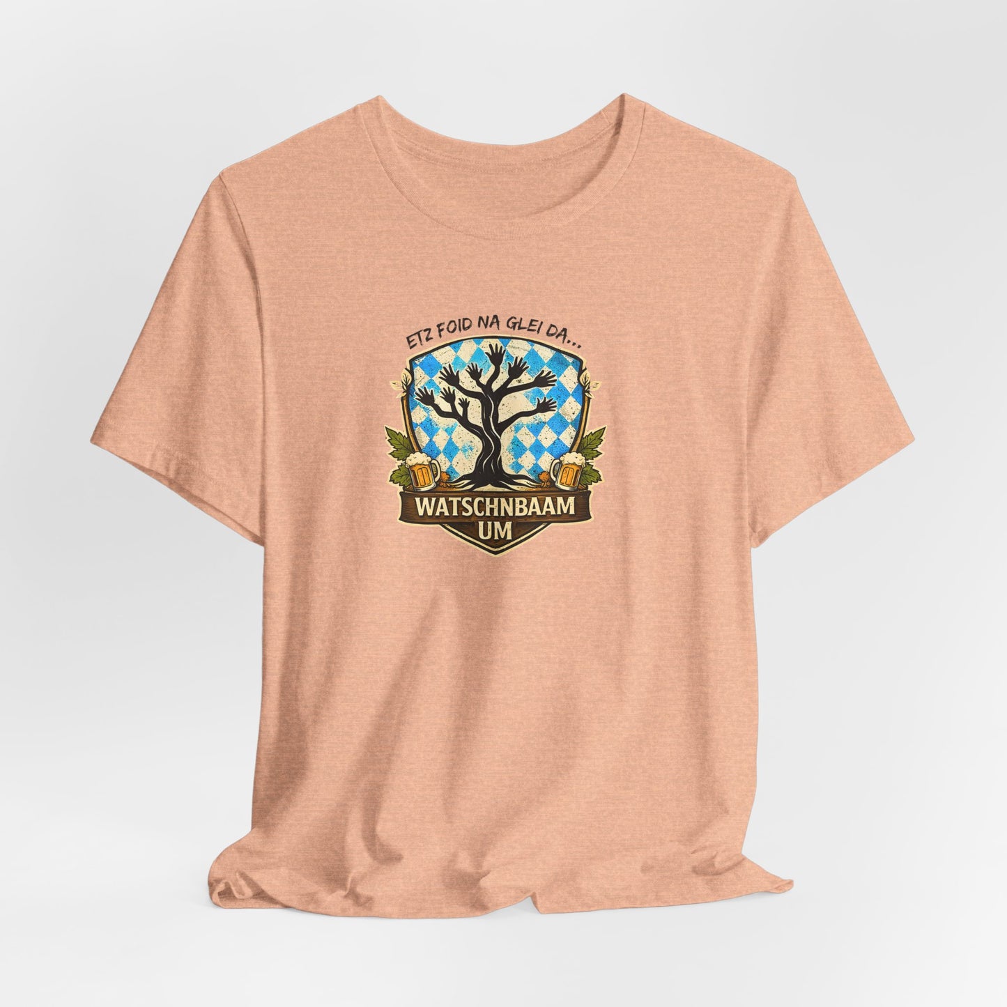 Watschnbaam T-Shirt in heather peach mit retro Baum-/Handgrafik und bayrischem Spruch „Etz foid na glei da… Watschnbaam um“, Bella Canvas 3001